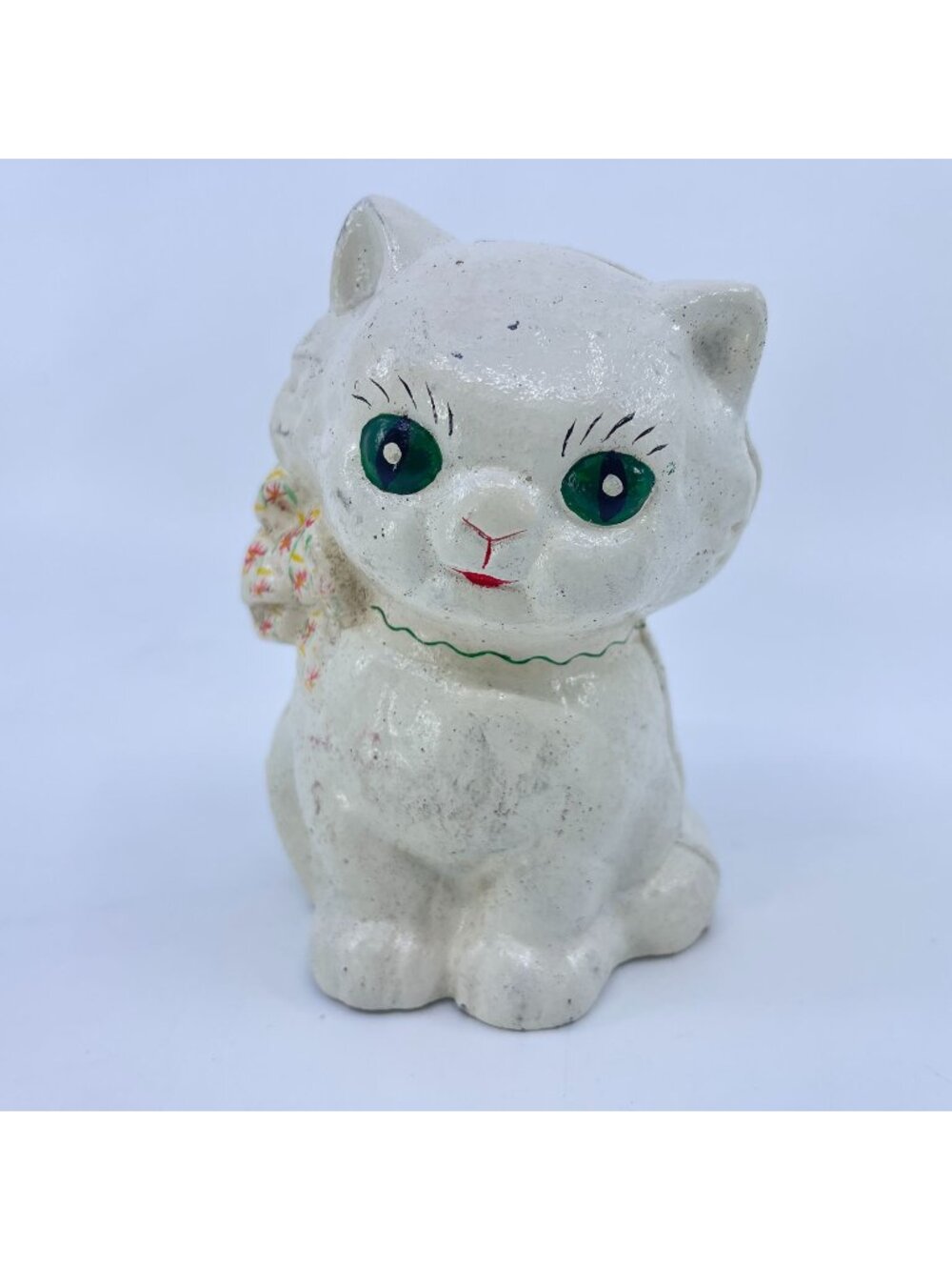 vintage cast iron cat coin bank with hand-painted details and green eyes